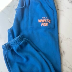 White fox Offstage Sweatpants in Azure blue.